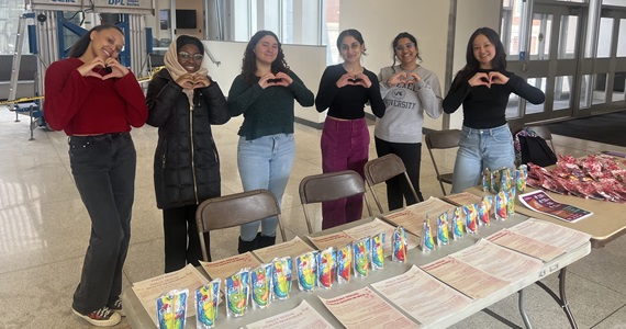 Members of the Maternal and Child Health Student Organization at their table hosted for Valentine’s Day
